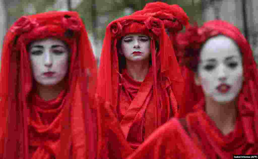 Climate-change activists protest during the ongoing Extinction Rebellion climate change demonstration near the Houses of Parliament in central London on April 23. (AFP/Isabel Infantes)