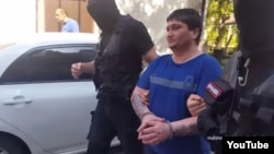 Armenia - A screenshot of official video of police raiding the homes of reputed crime figures and detaining them, 20 June 2018.