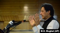 Pakistani Prime Minister Imran Khan addresses Kashmir's Legislative Assembly on the occasion of Pakistan's Independence Day in Muzaffarabad on August 14.