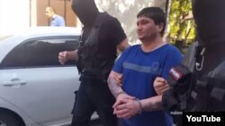 Armenia - A screenshot of official video of police raiding the homes of reputed crime figures and detaining them, 20 June 2018.