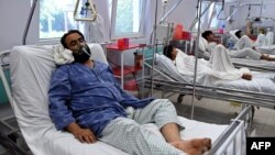 A wounded staff member of Doctors Without Borders (MSF), a survivor of the U.S. air strikes on the MSF Hospital in Kunduz, receives treatment at the Italian aid organization Emergency's hospital in Kabul on October 6.