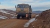 An Azerbaijani military vehicle moves along a road in the Kalbacar region on November 25.