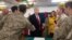 U.S. President Donald Trump and first lady Melania Trump greet members of the U.S. military during an unannounced trip to Al Asad Air Base in Iraq on December 26. 
