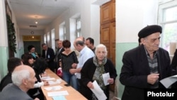 Voters case ballots in Nagorno-Karabakh's parliamentary elections on May 23.