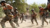 Afghan soldiers take positions in restive Achin district in the eastern Nangarhar province on August 18. Afghan and U.S. forces are engaged in an operation against the Islamic State militants in August.