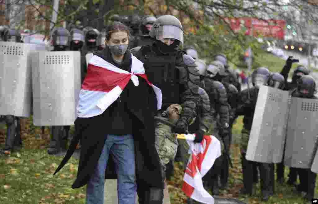 Belarusian police detain a protestor during an opposition rally in Minsk. (AP)