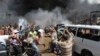 People react as they carry a dead body outside one of two mosques hit by explosions in the northern city of Tripoli, Lebanon. (Reuters/Omar Ibrahim)