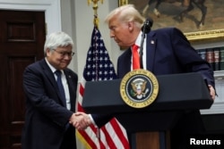 US President Donald Trump shakes hands with C.C. Wei, Chairman and CEO of TSMC, after annoucing a $100 billion investment on March 3.