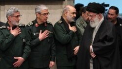 Ali Khamenei (R) greets newly-appointed commander of the Qods Force Ismail Qaani (L), and other IRGC commanders.