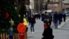 Kosovo - People walking in the decorated square in Prishtina, December 2020