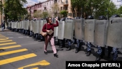 An Armenian woman confronts a line of riot police on Yerevan's main avenue: "I'm a journalist but before I'm a journalist I'm a citizen, and before you are police you are all citizens of Armenia!"