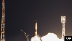 A Russian Soyuz TMA-21 rocket with the Russian-U.S. crew aboard blasts off from the Russian-leased Baikanur cosmodrome on April 5 toward the International Space Station.