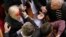 Ukrainian pro-government lawmaker Vladimir Malyshev is hurt during scuffles in parliament over an antiprotest law and other controversial legislation, which was passed on January 16.