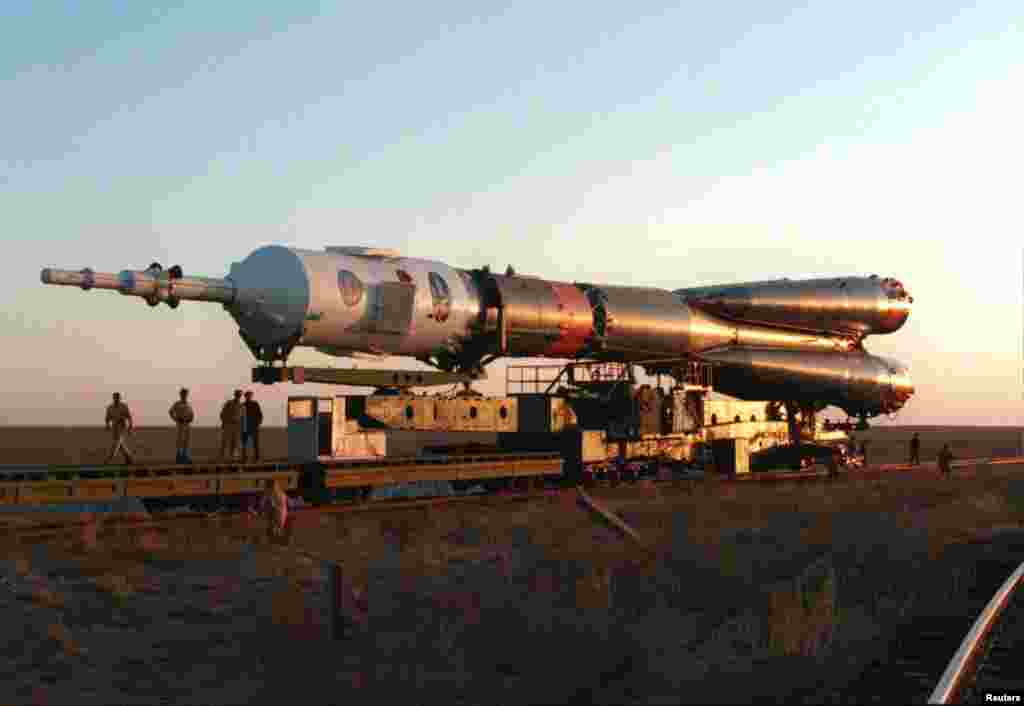 A Russian-made space rocket is transported by rail to the Baikonur launch site in October 1994.