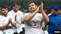 Chechen leader Ramzan Kadyrov claps during celebrations marking the 63rd birthday of Russian President Vladimir Putin in Grozny on October 7.