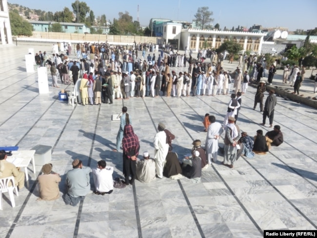 Afghans lined up to vote in eastern Khost Province on October 20.