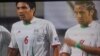 Iran's national soccer team players in World Cup qualifier v. South Korea in Seoul on 17jun2009.Green waistband is seen on one player.