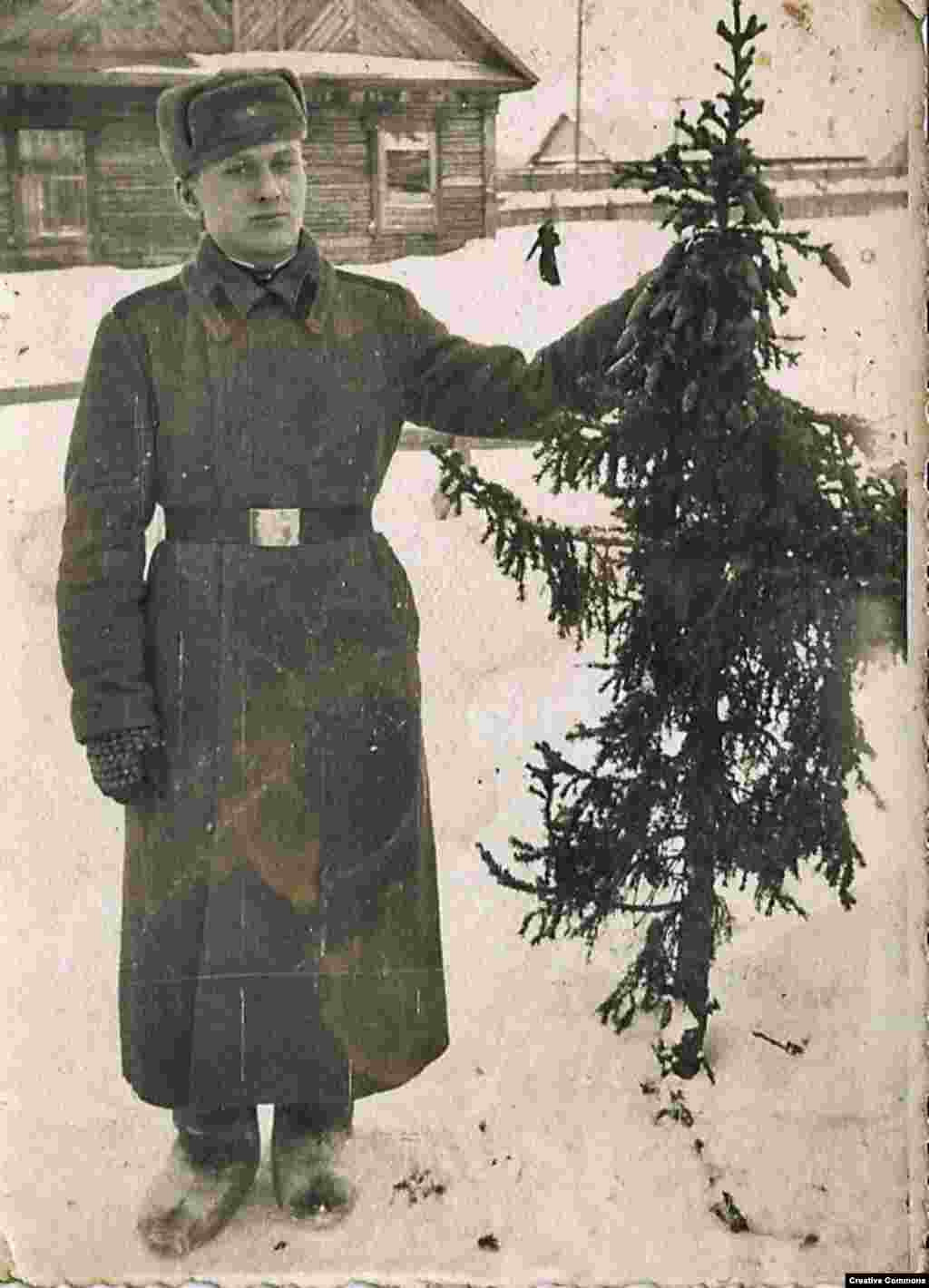 A Red Army soldier with a shaggy tree around World War II. In the 1930s, after a Soviet attempt to replace Christmas with a celebration of the Young Communist League failed to take off (surprising no one), Josef Stalin decreed that the festive trees could return -- but only to celebrate the conveniently Godless New Year's Eve.