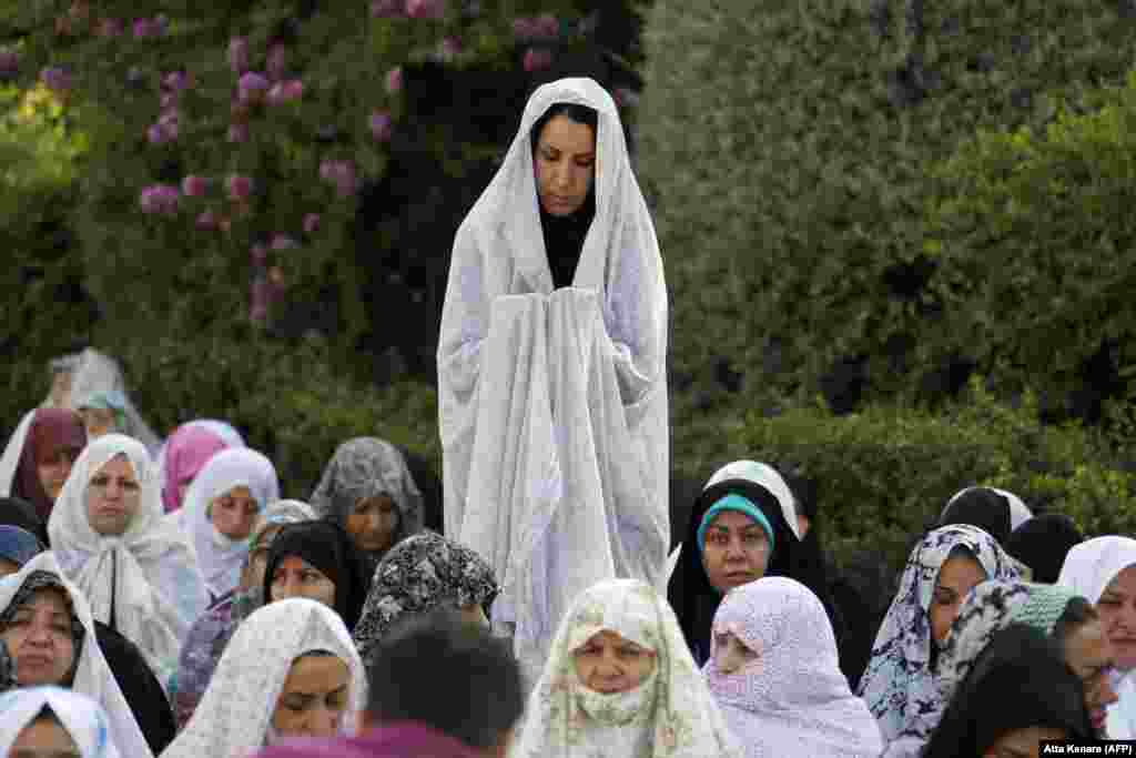 Iranian Muslim women perform Eid al-Fitr prayers in western Tehran.