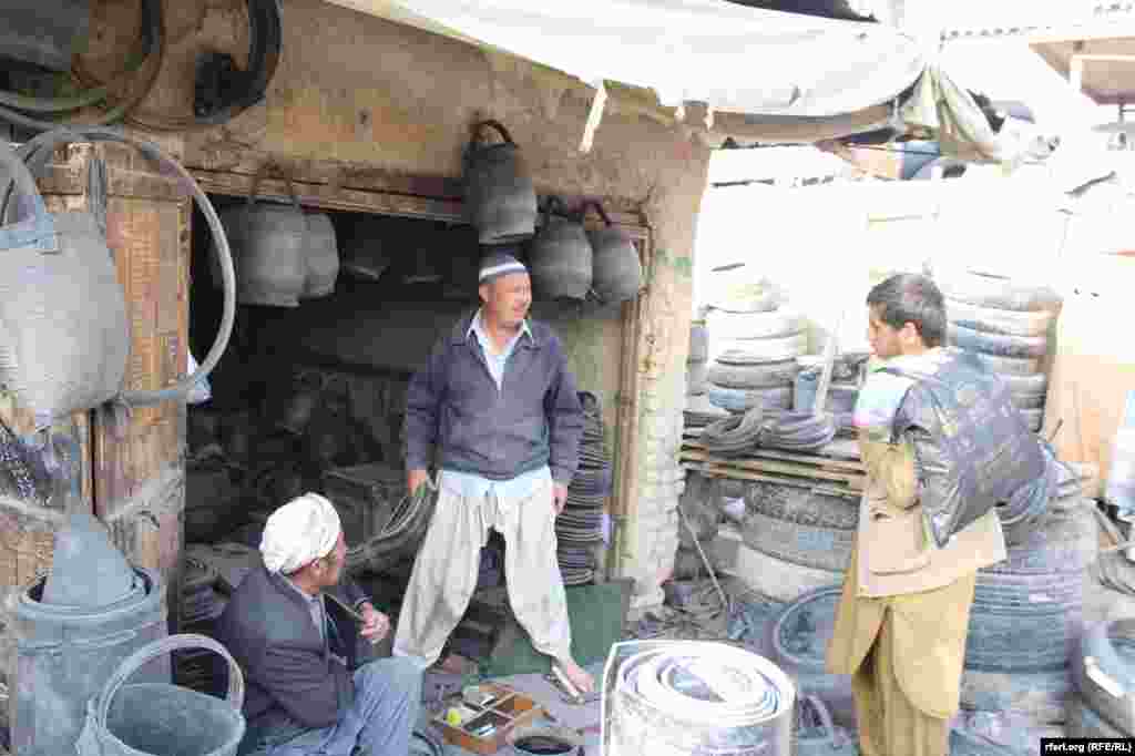 Afghanistan -- making rubber bucket, string, chair and table from used car tires in Kabul, 29 November 2015 