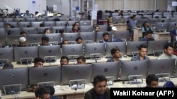 Independent Election Commission workers sit at computer terminals while election information from all over the country is gathered at the Data Center in Kabul.