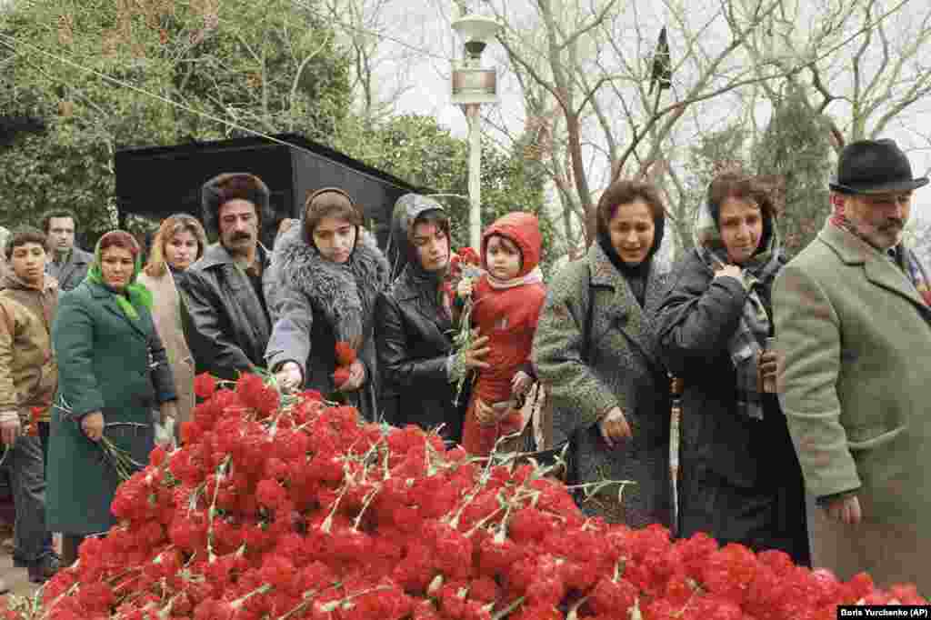 Baku residents lay flowers in remembrance of those killed during the Black January massacre in Baku on February 3, 1990. By the end of 1991, the Soviet Union had been dissolved.