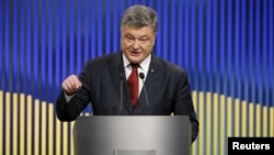 Ukrainian President Petro Poroshenko speaks during a news conference in Kyiv on January 14.