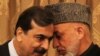 Afghan President Hamid Karzai (right) speaks with Pakistani Prime Minister Yousaf Raza Gilani in Kabul in April