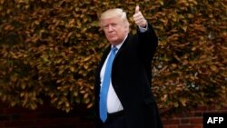 President-elect Donald Trump gestures as he arrives for a day of meetings at the clubhouse of the Trump National Golf Club in Bedminster, New Jersey, on November 20. 