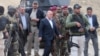 Iraqi Prime Minister Haider al-Abadi (center) visits Ramadi on December 29 after the city had been retaken from Islamic State extremists. 