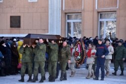 Похороны боевиков с участием детей. Кадр канала, подконтрольного российским гибридным силам