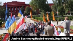 A small group of activists celebrates Belarusian Independence Day in Kyiv, capital of neighboring Ukraine.