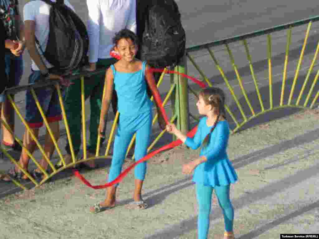 Two young rhythmic gymnasts practice their Independence Day routine at the Labor Stadium in Turkmenabat.