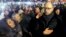 Ukrainian opposition leader Arseniy Yatsenyuk (right) joins antigovernment protesters in the singing of the Ukrainian national anthem at the "Euromaidan" encampment on Independence Square in Kyiv in mid-December.