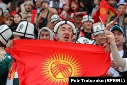 A Kyrgyzstan fan shows his national pride during a Kok Boru match against Uzbekistan on September 9.