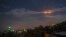A picture taken early on January 21, 2019 shows Syrian air defense batteries responding to what the Syrian state media said were Israeli missiles targeting Damascus.
