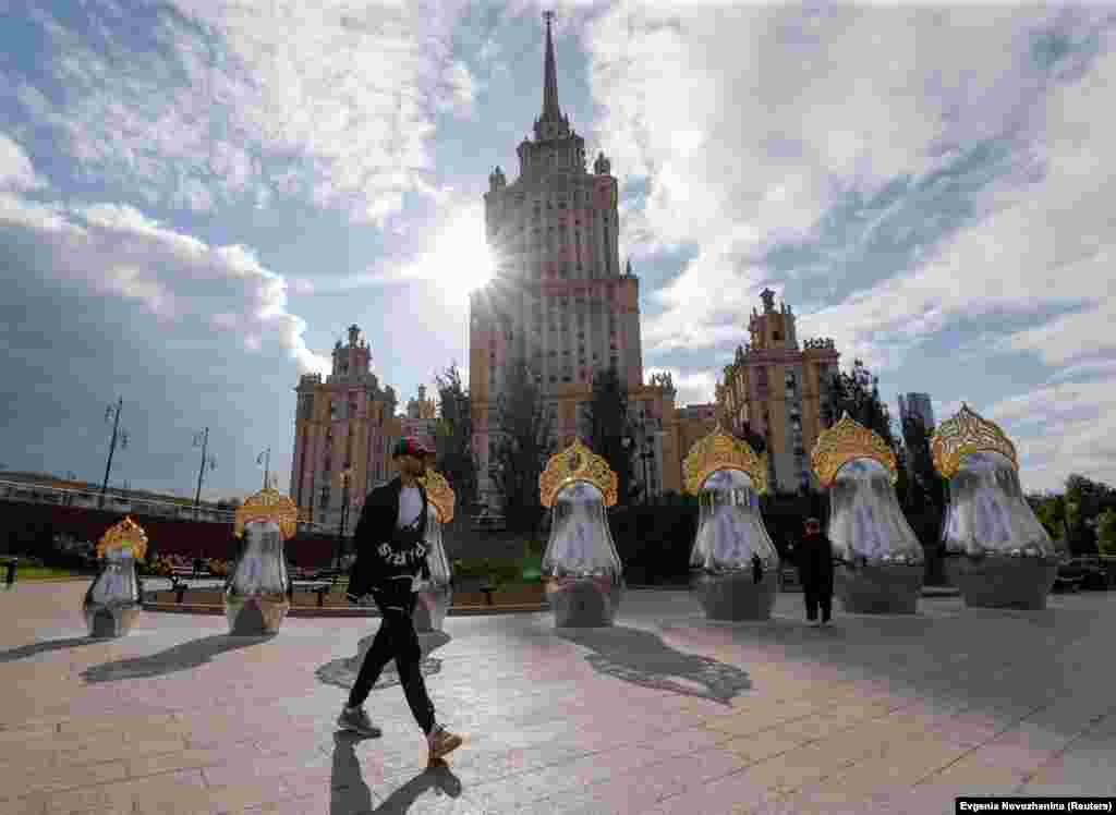 An art object, which consists of seven Russian traditional nesting dolls, also known as &quot;matryoshka&quot; dolls, decorated with the traditional &quot;kokoshnik&quot; headwear and mirrored surface, is on display near a Soviet-era landmark building in Moscow.