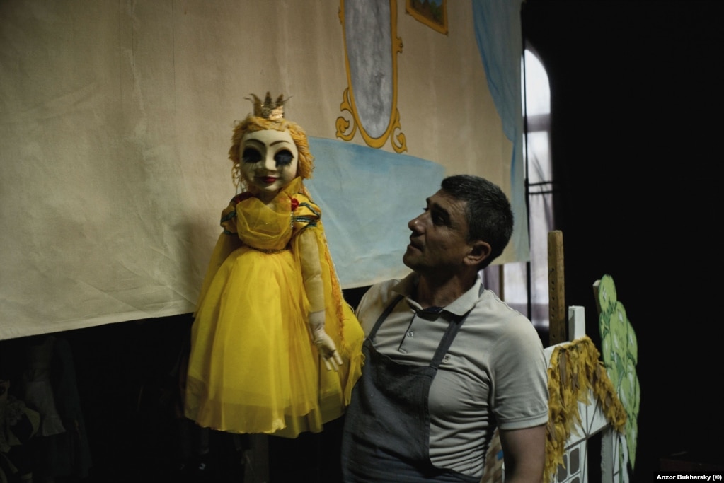 A puppeteer poses between shows in Khiva.