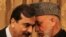 Afghan President Hamid Karzai (right) speaks with Pakistani Prime Minister Yousaf Raza Gilani in Kabul in April