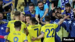 Kosovar players celebrate with fans after their second goal in a match against Bulgaria in June. Kosovo won 3-2.