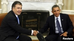 U.S. President Barack Obama (right) welcomes his Georgian counterpart, Mikheil Saakashvili, to the White House on January 30.