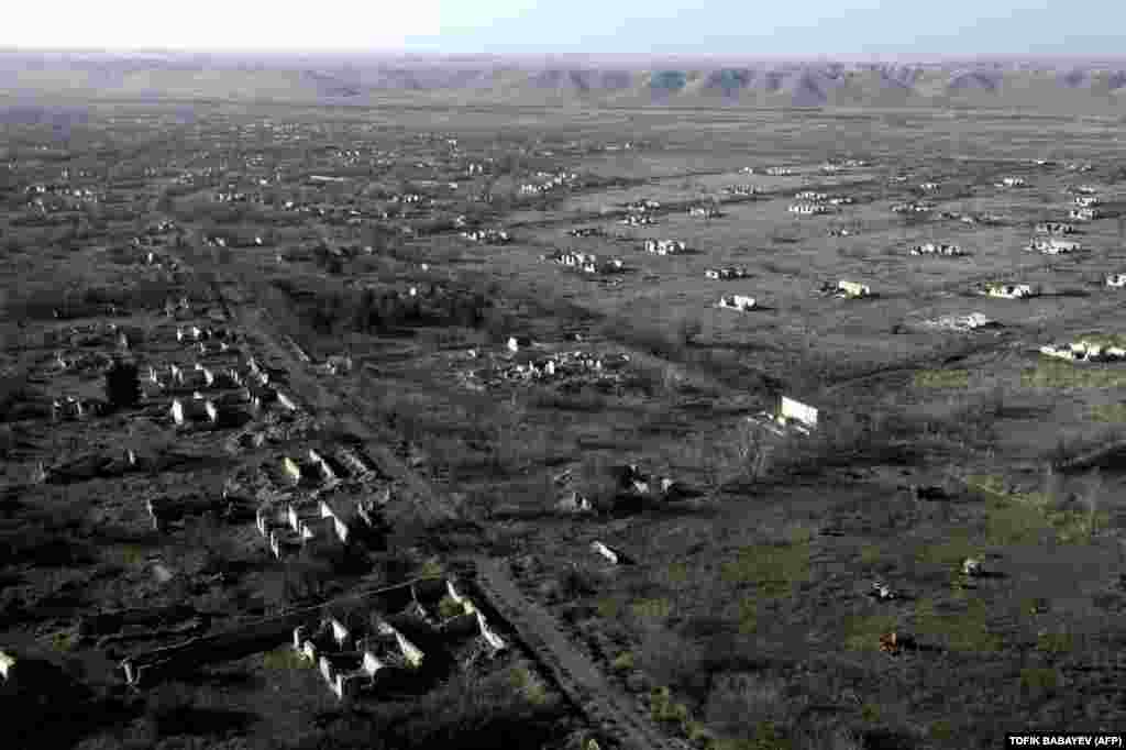 This aerial view taken on January 5 shows the ruins of the village of Zangilan in an area recaptured by Azerbaijan in October 2020 during a six-week war with Armenia over the breakaway region of Nagorno-Karabakh. (AFP/Tofik Babayev)