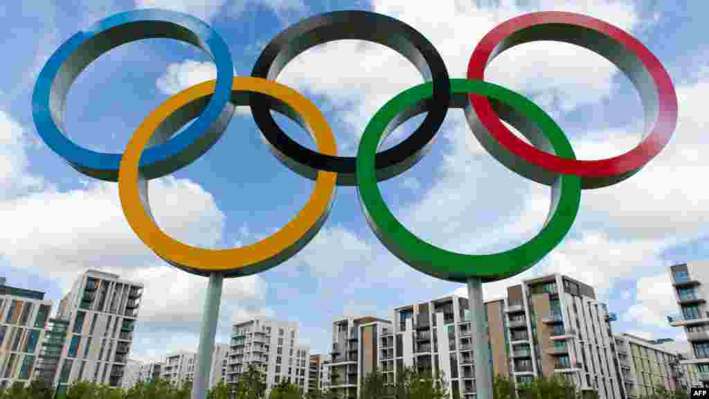 U.K. -- The London 2012 Olympic Athletes Village is pictured through the Olympic Rings in east London, 12Jul2012