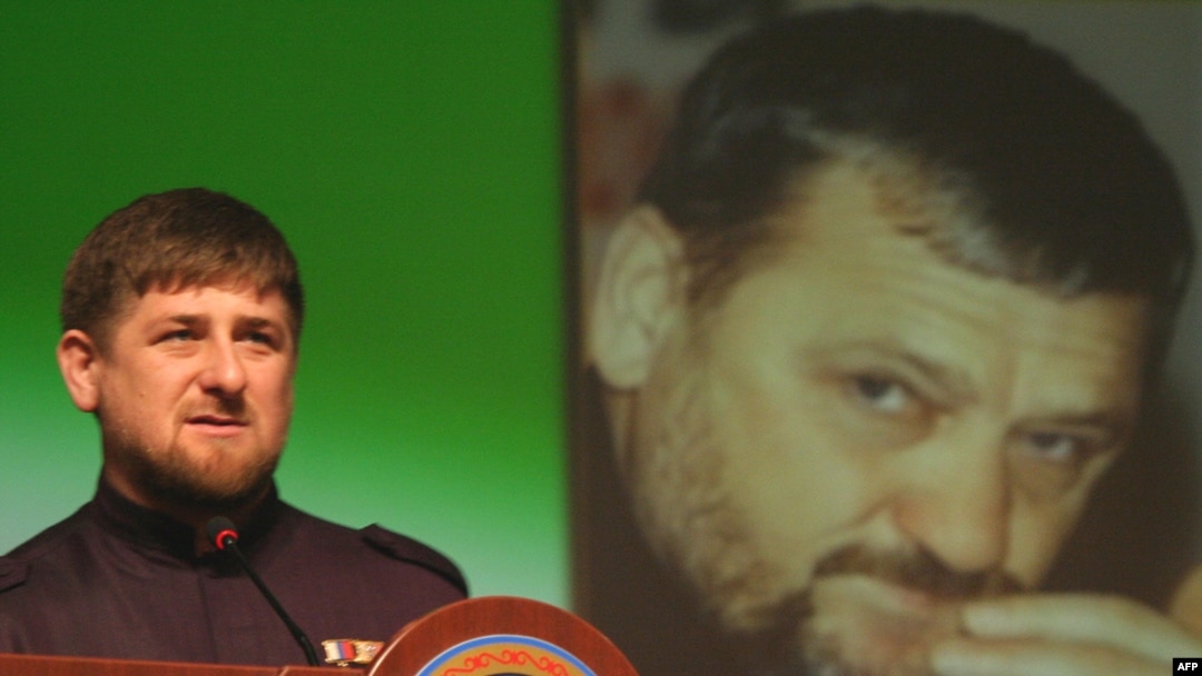 Chechen leader Ramzan Kadyrov in front of a portrait of his father Akhmad Kadyrov, who was assassinated in 2004. 