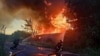 This handout photograph taken and released by Ukrainian State Emergency Service on July 9, 2025, shows firefighters extinguishing a fire after a Russian attack in Kyiv region, amid the Russian invasion of Ukraine.
