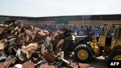 Iran occasionally confiscates satellite receivers from homes and dishes from rooftops and destroys them. Photo from a huge haul being destroyed in Tehran, July 24, 2016