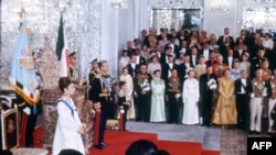 Picture shot 26 October 1967 during the coronation ceremony of Mohammad Reza Pahlavi (L) as Shah of Iran. Prince Reza, a school-age boy stands to the left of his father. Iran's Peacock Throne behind the Shah.