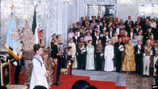 Picture shot 26 October 1967 during the coronation ceremony of Mohammad Reza Pahlavi (L) as Shah of Iran. Prince Reza, a school-age boy stands to the left of his father. Iran's Peacock Throne behind the Shah.