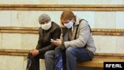 Ukrainians wear surgical masks in an attempt to prevent the spread of the flu.