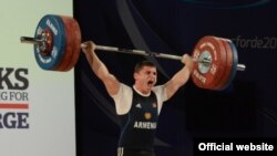 Armenian weightlifter Andranik Karapetian wins a gold medal at the European championships in Norway